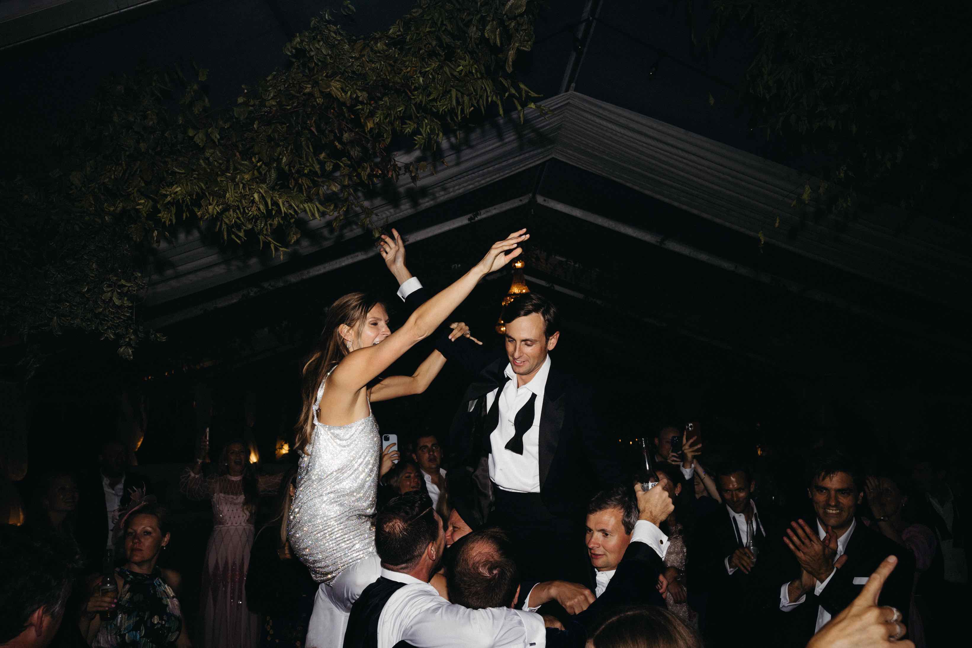 Katie & Cal's wedding - bride and groom crowd surfing!